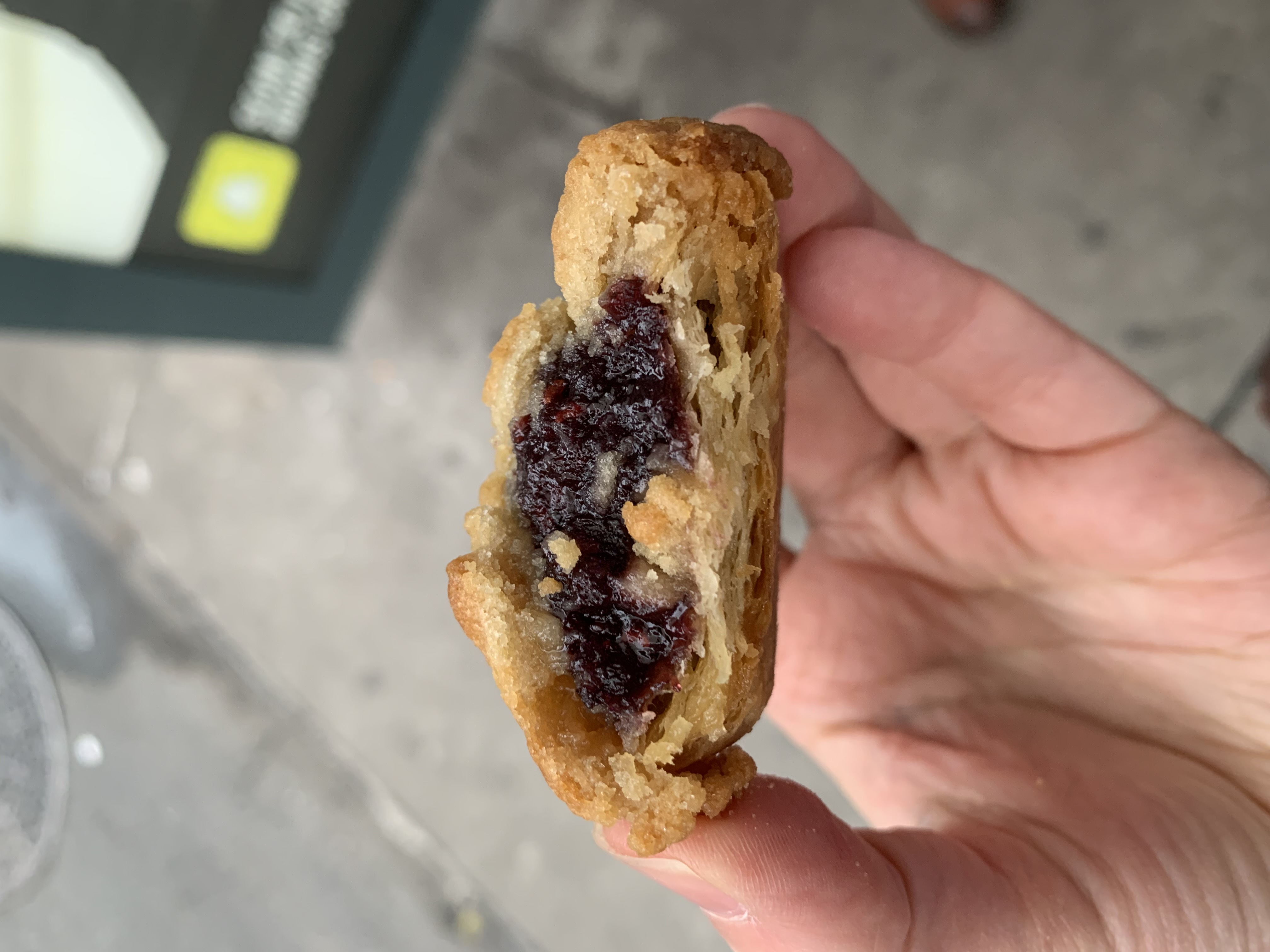 A vew of the inside of a Janie's Pie Cookie. This one is a deep purple from the trile berry filling.