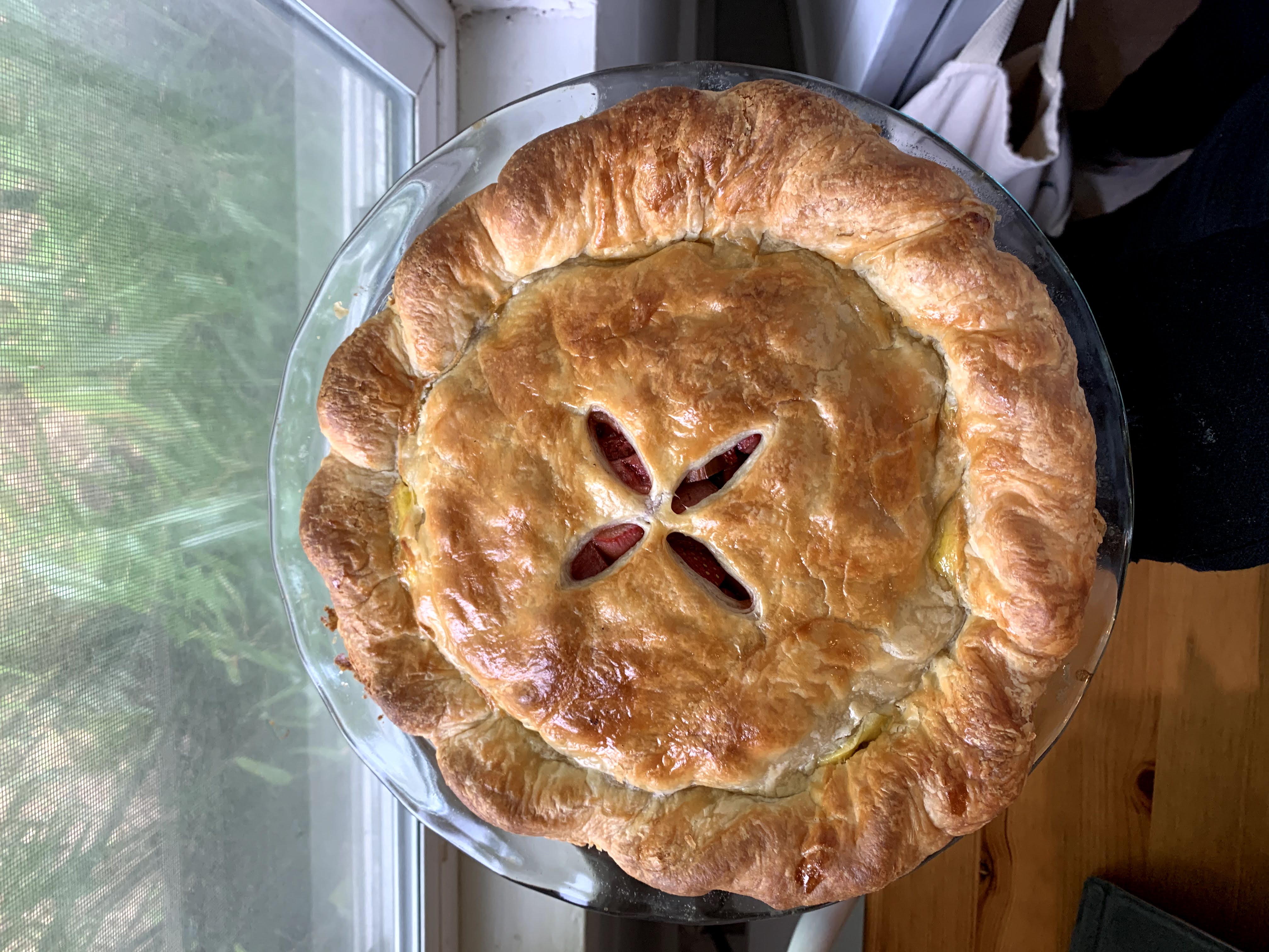 A strawbery rhubarb pie with with a rope crimped top crust.